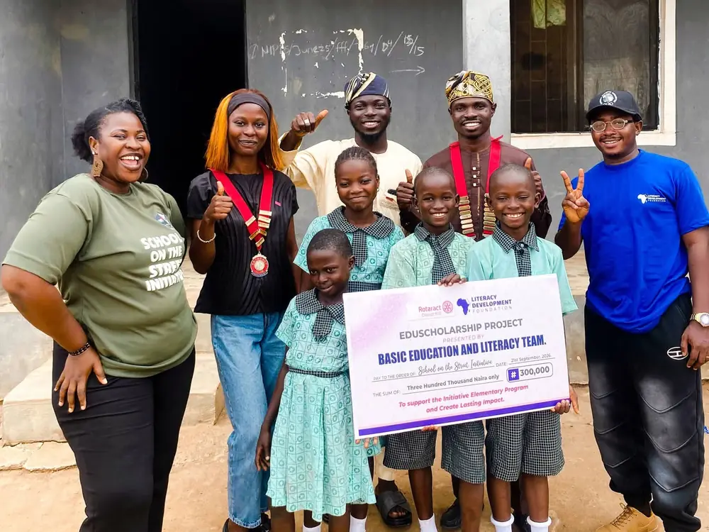 Pupils of School on the Street Initiative with LDF, Rotaract District 9112 and school staff, holding the ₦300,000 EdFund scholarship cheque, 21 September 2026